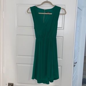 Green open back dress